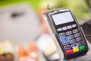 Credit card terminal. Credit Card Processor. Payment machine and Credit card in supermarket.