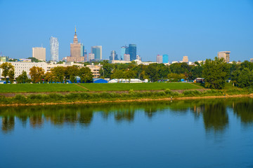 Fototapeta na wymiar Warsaw, Poland - Panoramic view of the Warsaw city center skyscrapers and Solec district across the Vistula river