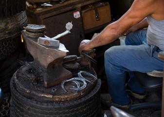 workshop forging. hammer close-up, horseshoe, hammer anvil