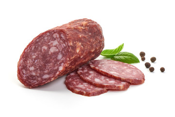 Salami smoked sausage, basil leaves and peppercorns, isolated on white background.