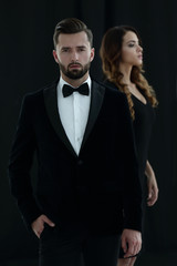 gentleman with his girl posing in the studio