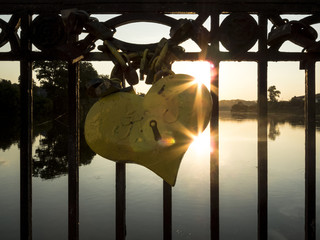 Sunset behind the heart-lock.