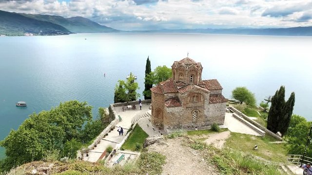 Ohrid landmark, showing church of Saint John at Kaneo and lake in the background by dramatic day