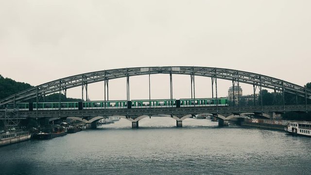 New metro train MF2000 traveling on line 5 of the Paris subway network on bridge over Seine river near Austerlitz train station
