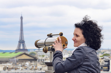 Attractive happy smiling woman looking on Paris cityscape, Eiffel tower and opera garnier.