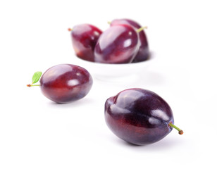 Plums on white background