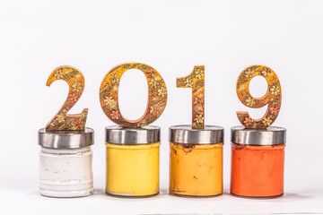 number of the year 2019 is made in gold color place on plastisol ink in white background