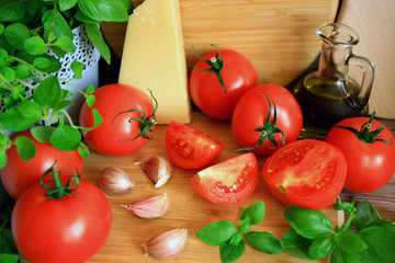  Italian cuisine products: tomatoes, olive oil, garlic, basil, cheese