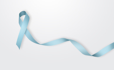 Blue ribbon on a gray background. Concept of fighting against cancer, with breast cancer. World Cancer Day, awareness month. Prevention in the fight against cancer.