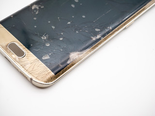close-up of damaged smartphone display with white background
