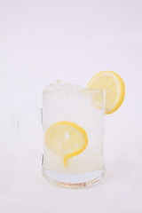 Glass of lemon juice isolated on white background