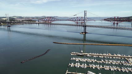 Aerial image looking over the marina at South Queensferry to the Forth road and rail bridge.