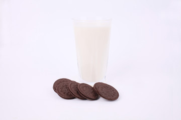 Milk with biscuit isolated on white background
