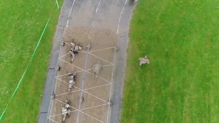 An aerial over an obstacle course during army basic training. - Powered by Adobe