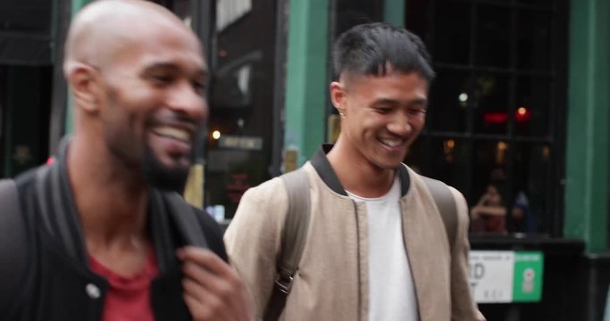 Group of male friends leaving pub