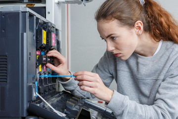 Technician working on photocopier