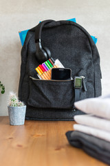 Back to school concept with uniform and electronic devices