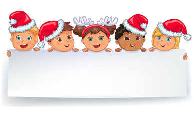 Cute kids in caps Santa Claus holding white blank banner