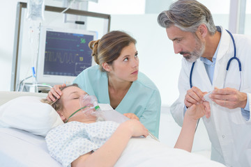 doctor and nurse with patient in hospital