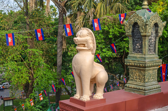 A lion statue or leogryph at the steps of the main stupa  of Wat Phnom (Mountain Pagoda), in Phnom Penh in Cambodia