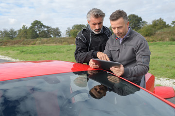 pilot and engineer checking last races performances durint tests