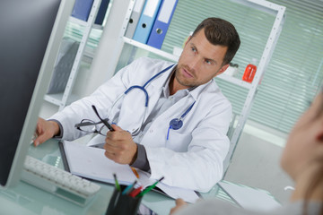 doctor reviewing the condition file