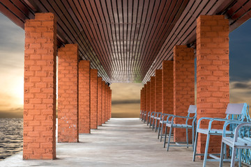 Brick columns with benches on the morning.