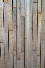 Wood background composed of different boards joined with nails, and an iron frame.