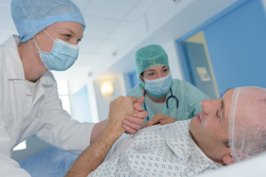 patient speaking with surgeon after operation