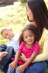 Mixed race mother and her children.