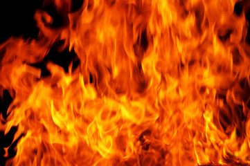 A background filled with defocused fire flames.