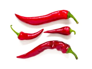 Fotobehang Four pods of hot red chili pepper with green cuttings isolated on white background © roundex