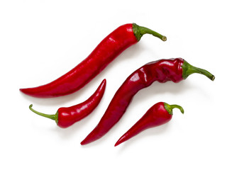 Red pepper pods with green cuttings isolated on white background