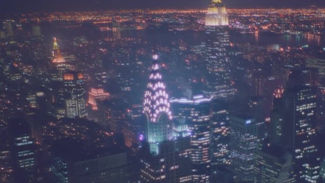 1992 - Nightime aerial of Manhattan New York skyline night includes Chrystler Building.