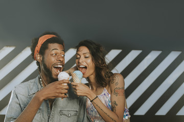Cheerful couple enjoying ice cream