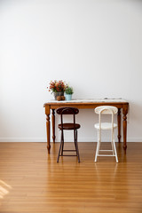There are various funitures in the livingroom where has a large floor made of wood. Interior of here is bright and clean because of white color wall and good natural light.