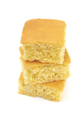 Square Cornbread Slices on a White Background