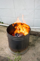 Close up paper burning in flame. Burning paper in the bin.