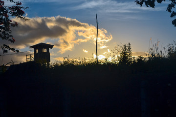 silhouette of little house at sunset