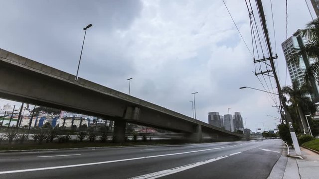 "SAO PAULO, BRAZIL - CIRCA FEBRUARY 2018: Timelapse of cars walking along the marginal Pinheiros on a cloudy da"