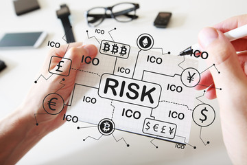 Cryptocurrency risk theme with man writing in a notebook