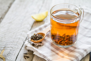 Black tea in glass cup, closeup