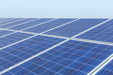 Close up rows array of polycrystalline silicon solar cells or photovoltaics in solar power plant systems convert light energy from the sun into electricity alternative renewable energy
