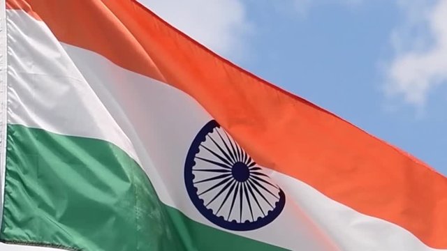 The flag of India waves in the wind in slow motion.