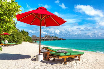 Sunbed and umbrella in the Maldives