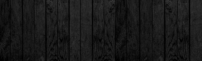 Panorama of black wood wall background and texture