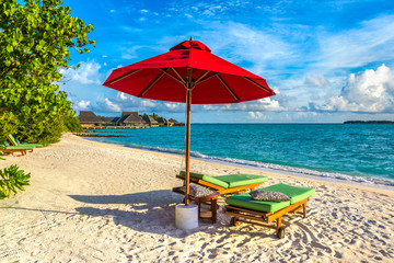Sunbed and umbrella in the Maldives