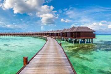Fototapeta na wymiar Water Villas (Bungalows) in the Maldives