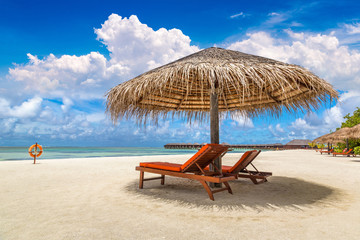 Sunbed and umbrella in the Maldives