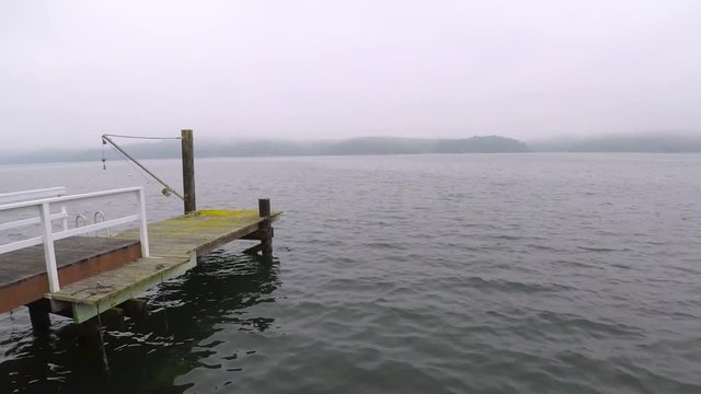 10 minute timelapse of a boat, deck, and calm waters. Shot on a cloudy day.